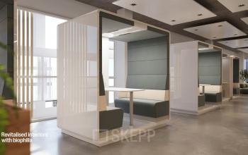 Interior office space rental at Jacob Bontiusplaats 9, Amsterdam East, featuring modern, semi-enclosed seating booths with green upholstery and clean, minimalist design.