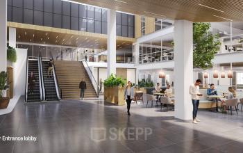 Modern entrance lobby of an office located at Jacob Bontiusplaats 9, Amsterdam East with people engaged in business activities. Contemporary design with ample natural light and casual meeting areas.