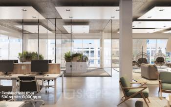 Modern open-floor office space for rent at Jacob Bontiusplaats 9, Amsterdam East, featuring large windows, desks, indoor plants, and lounge area.