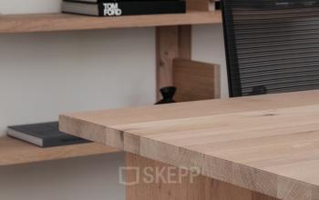 Furnished office interior at Emmalaan 7-9, featuring wooden shelves and a desk in Amsterdam Old South, ideal for office space rental.