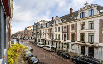 Street view of PC Hooftstraat 150 in Amsterdam Old South with historic buildings and parked cars, ideal for office space rental.