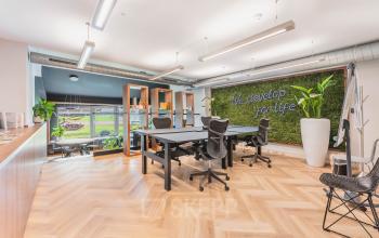 Bright office space with modern furnishings, including desks and ergonomic chairs, located at Olympisch Stadion 24-28, Amsterdam Old South.