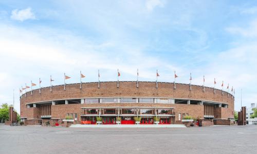 Exterior view of Olympisch Stadion 24-28 in Amsterdam Old South, available for office space rental.
