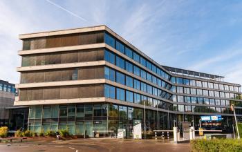 Modern office building exterior at John M. Keynesplein 4-10, Amsterdam Riekerpolder, suitable for office space rental.