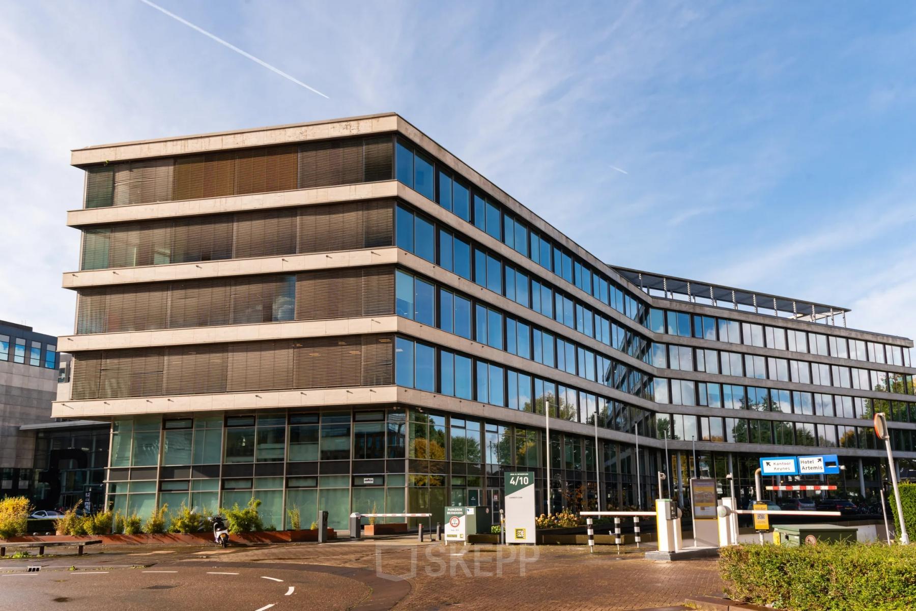 Modern office building exterior at John M. Keynesplein 4-10, Amsterdam Riekerpolder, suitable for office space rental.