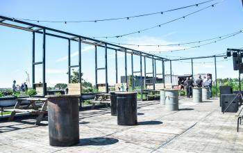 Energetic outdoor gathering space at the Amsterdam Riekerpolder office space rental on Johan Huizingalaan 761-763 a.