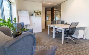 Interior office space at Radarweg 29, Amsterdam Sloterdijk, featuring modern furnishings with desks, chairs, and plants, ideal for office space rental.