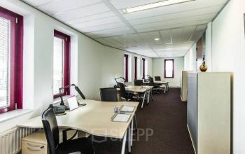 Modern office space rental at Kingsfordweg 151, Amsterdam Sloterdijk with rows of desks, computers, and bright lighting.