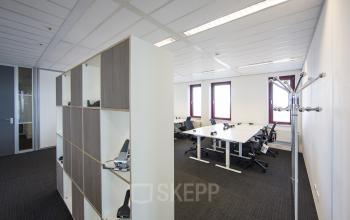Office to rent at Kingsfordweg 151, Amsterdam Sloterdijk, featuring modern workspace with desks, chairs, shelves, and natural light from windows.