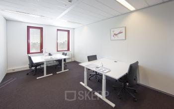 Modern office space rental at Kingsfordweg 151, Amsterdam Sloterdijk with white desks, comfortable chairs, and ample natural light.