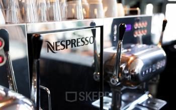 Close-up of a Nespresso coffee machine in an office at Teleportboulevard 110, Amsterdam Sloterdijk, ideal for office space rental.