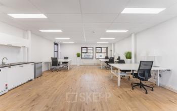 Bright and airy office space with modern furnishings and large windows, available for rent at Arlandaweg 92, Amsterdam Sloterdijk.