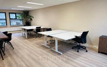 Bright office space at Arlandaweg 92, Amsterdam Sloterdijk, featuring multiple desks and chairs, ideal for office space rental.