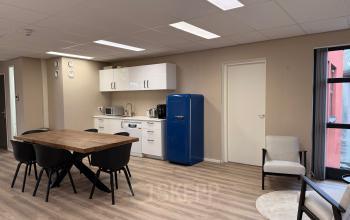 Well-lit office space with a modern dining area and kitchenette at Arlandaweg 92, ideal for an office space rental in Amsterdam Sloterdijk.