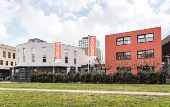Exterior view of the office building located at Arlandaweg 92, Amsterdam Sloterdijk, Amsterdam. The building features modern architecture with a rounded facade.