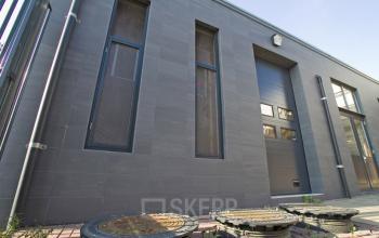 Exterior view of the office building located at Elektronstraat 15, Amsterdam Sloterdijk. The modern facade features tall windows and a sleek entrance.