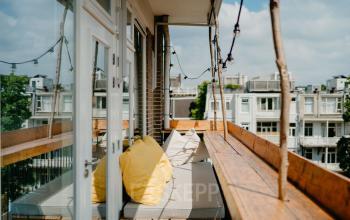 Bright office space rental at Overtoom 141 with comfortable seating and city views in Amsterdam West.