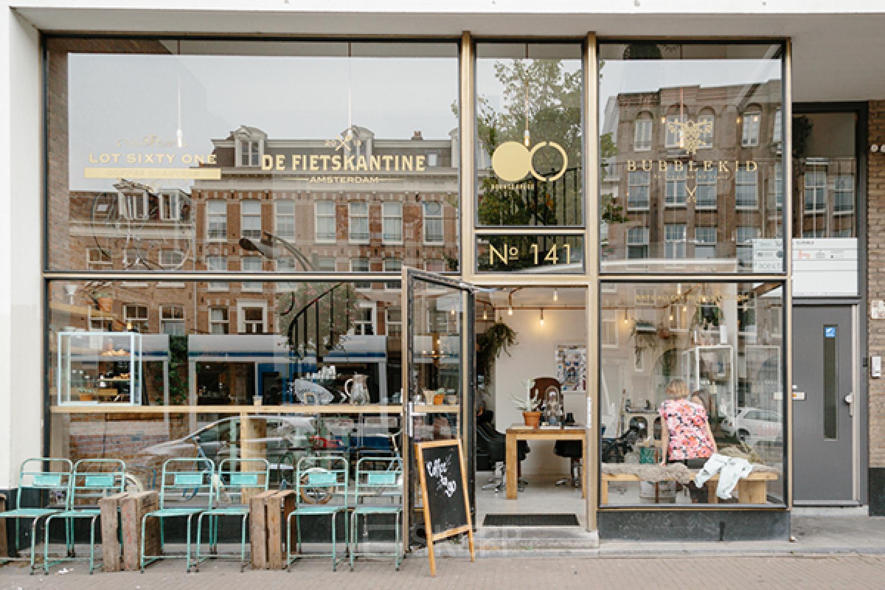Chic storefront at Overtoom 141 in Amsterdam West, showcasing an inviting office space rental with large windows and a trendy exterior.