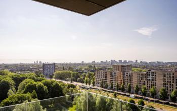 View from an office to rent at Nachtwachtlaan 20, overlooking the city and green areas in Amsterdam West.