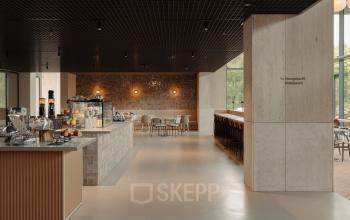 Modern office space in Amsterdam West at Nachtwachtlaan 20 featuring a stylish, furnished interior with seating areas and coffee station, ideal for office space rental.