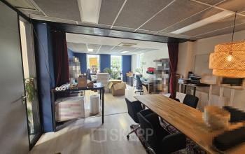 Office space at Gyroscoopweg 23-25, Amsterdam Westpoort, showing a modern workspace with desks, chairs, and office supplies, suitable for office space rental.