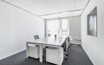 Bright office space at Hullenbergweg 278, Amsterdam South East with a large table and chairs, ideal for rent office space.