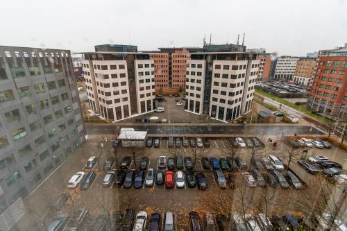 View of an urban office district with modern buildings and a spacious parking lot in Amsterdam South East.
