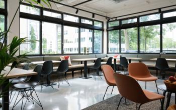 Stylish office space rental at Hogehilweg 19, Amsterdam South East, featuring modern furniture and ample natural light.
