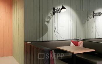 Contemporary office space rental at Hogehilweg 19 in Amsterdam South East featuring a stylish lounge with designer lighting and comfortable seating.