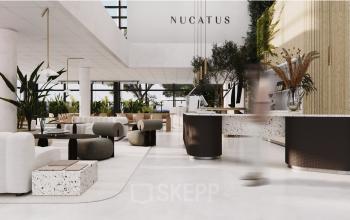 Elegant office space rental in Amsterdam South East featuring a modern, furnished interior with stylish seating areas and natural lighting.