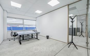 Bright office space interior with desks and chairs, perfect for those seeking office space rental in Amsterdam South East.