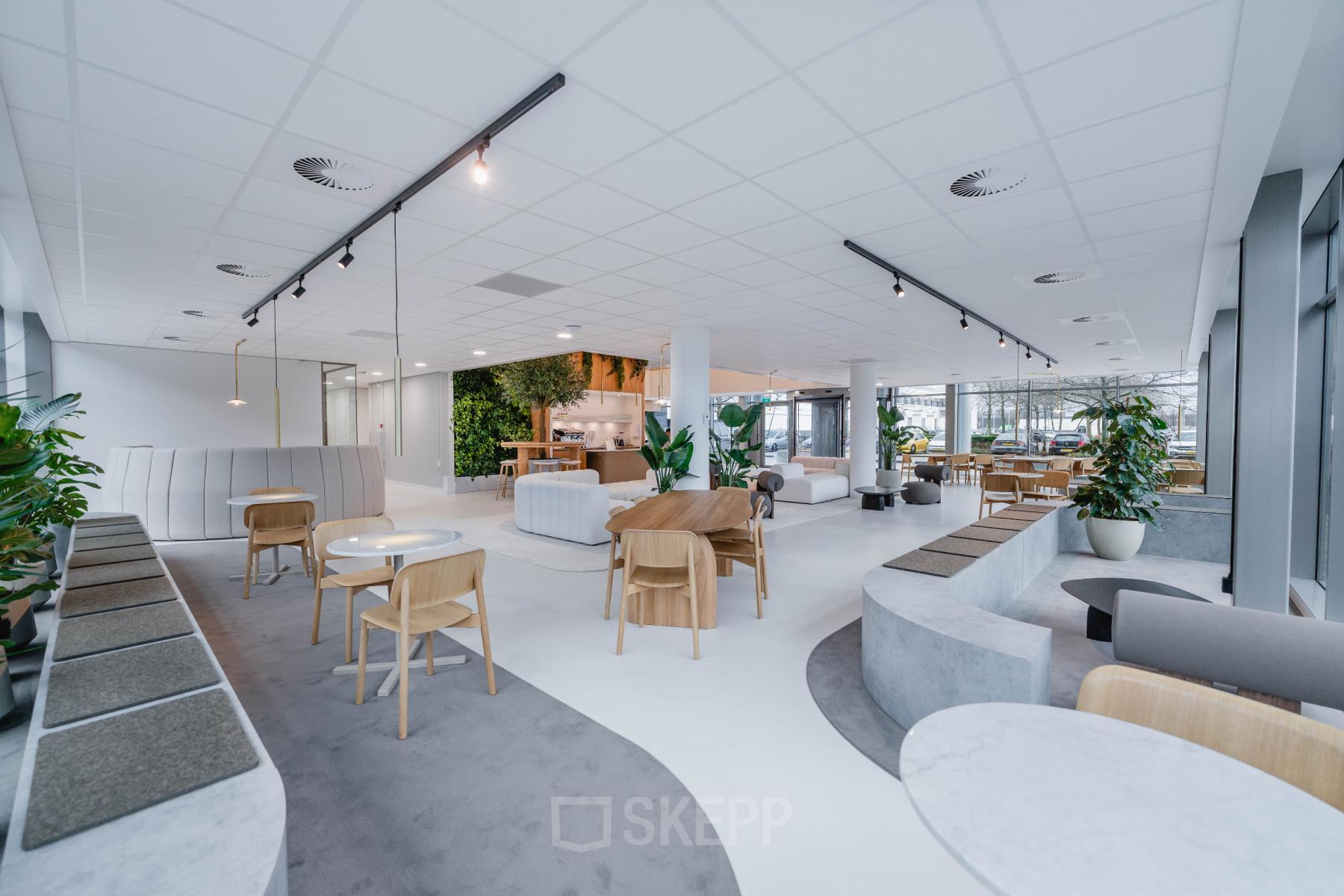 Spacious and modern office to rent in Amsterdam South East, featuring stylish furnishings and ample seating areas.