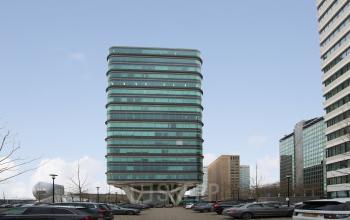 Exterior view of a modern office building with a unique design located at De Entree 230-266, in Amsterdam South East. The building offers potential office space rental opportunities.