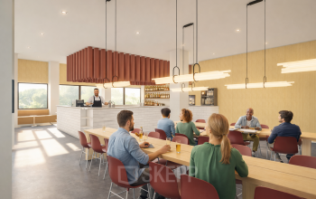 Professionals seated at long tables in a well-lit, modern lounge at the Luttenbergweg 8 office in Amsterdam South East, ideal for rent office space.