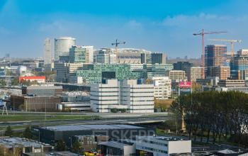 Skyline view of Amsterdam South East, highlighting modern office buildings near Luttenbergweg 8 with potential office space rental options.