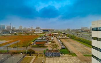 Panoramic view of Luttenbergweg 8, Amsterdam South East showcasing the surrounding landscape and office buildings, perfect for office space rental.