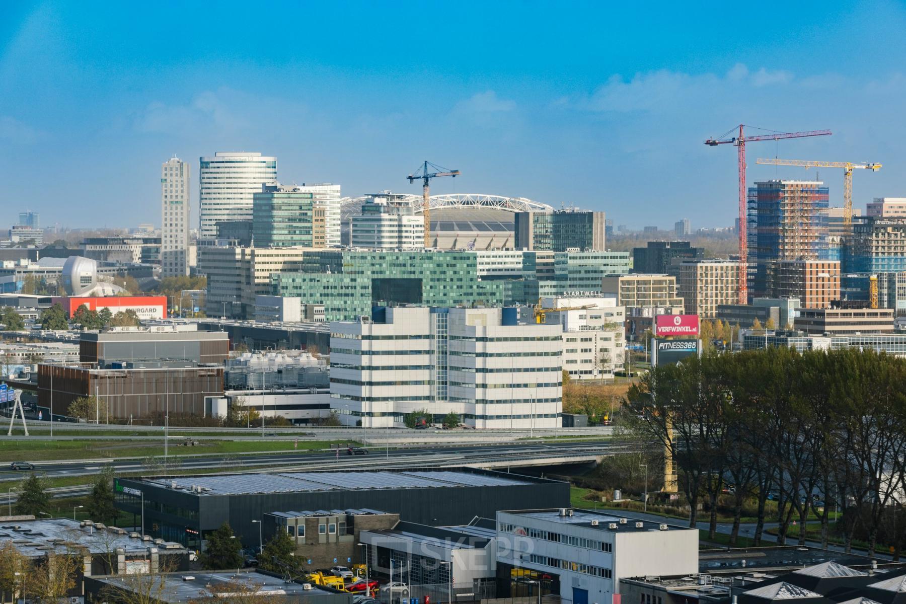 Skyline view of Amsterdam South East, highlighting modern office buildings near Luttenbergweg 8 with potential office space rental options.