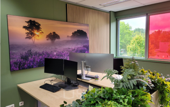 Furnished office space with large windows and plant decor at Johan Cruijff Boulevard 89, ideal for rent office space in Amsterdam South East.