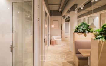 Modern, furnished office space rental at Hullenbergweg 109-135, Amsterdam South East, featuring stylish seating areas and contemporary decor.