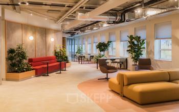 Modern office to rent at Hullenbergweg 109-135, Amsterdam South East, featuring stylish furniture and vibrant natural light.