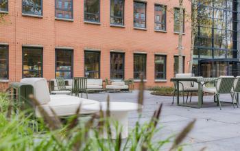 Outdoor seating area at Hullenbergweg 109-135, Amsterdam South East, ideal for breaks and informal meetings. Consider this spot when looking to rent office space.