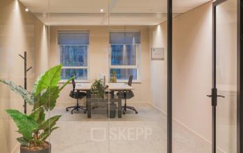 Stylish office to rent at Hullenbergweg 109-135, Amsterdam South East, featuring modern furnishings and greenery.