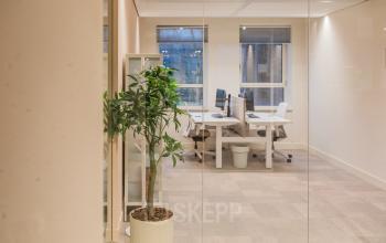 Bright office space at Hullenbergweg 109-135, Amsterdam South East, featuring large windows and desks, available for office space rental.
