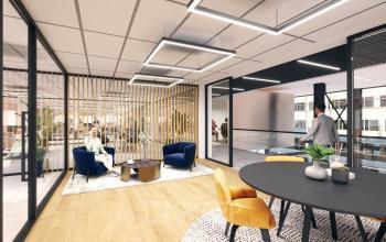 Modern office space with stylish furniture at Herikerbergweg 290, Amsterdam South East, ideal for rent. People engaging in discussions and utilizing workspaces.
