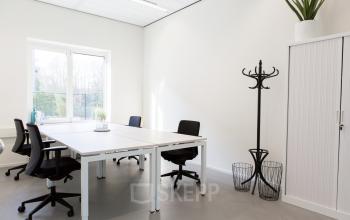 Bright office space with modern desks, chairs, and natural light at Burgemeester Stramanweg 102 in Amsterdam South East.