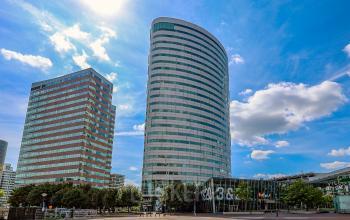 Modern office building exterior at De Entree 99-197, Amsterdam South East, ideal for office space rental.