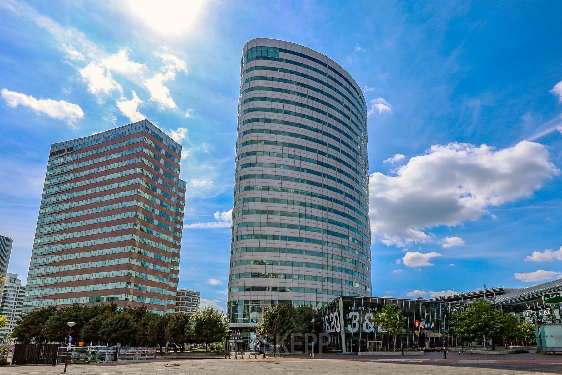 Modern office building exterior at De Entree 99-197, Amsterdam South East, ideal for office space rental.