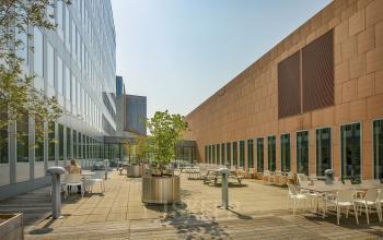 Spacious outdoor terrace of an office at Jachthavenweg 109-A, Amsterdam Zuidas with seating areas and potted plants, ideal for breaks or informal meetings.