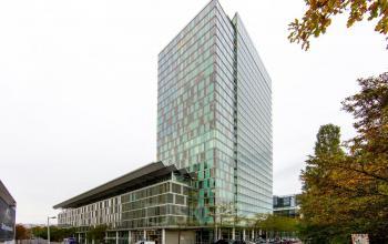 Exterior view of the office building at Zuidplein 36, Amsterdam Zuidas, Amsterdam, highlighting modern architecture and office space rental opportunities.