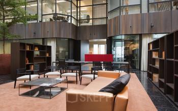 Elegant office space rental at Strawinskylaan 3051, Amsterdam Zuidas, with modern furnishings and a welcoming ambiance.